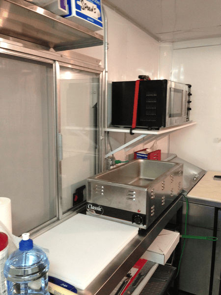 Prep area and service window of food trailer