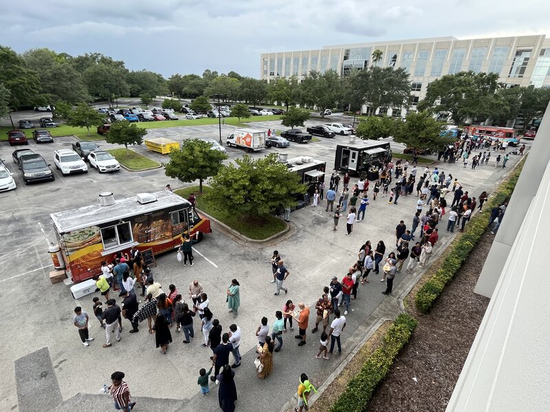 Meal service as attendees choose their food truck.